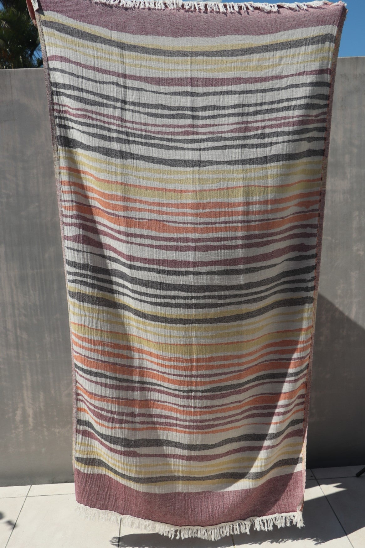 Earthy coloured towel shown in full length