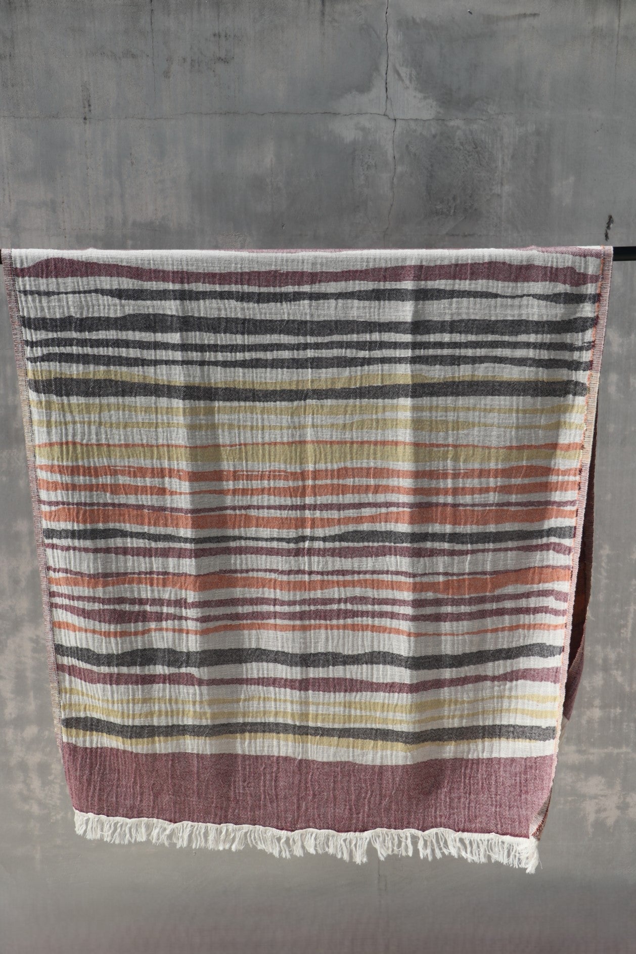 earthy coloured towel hanging