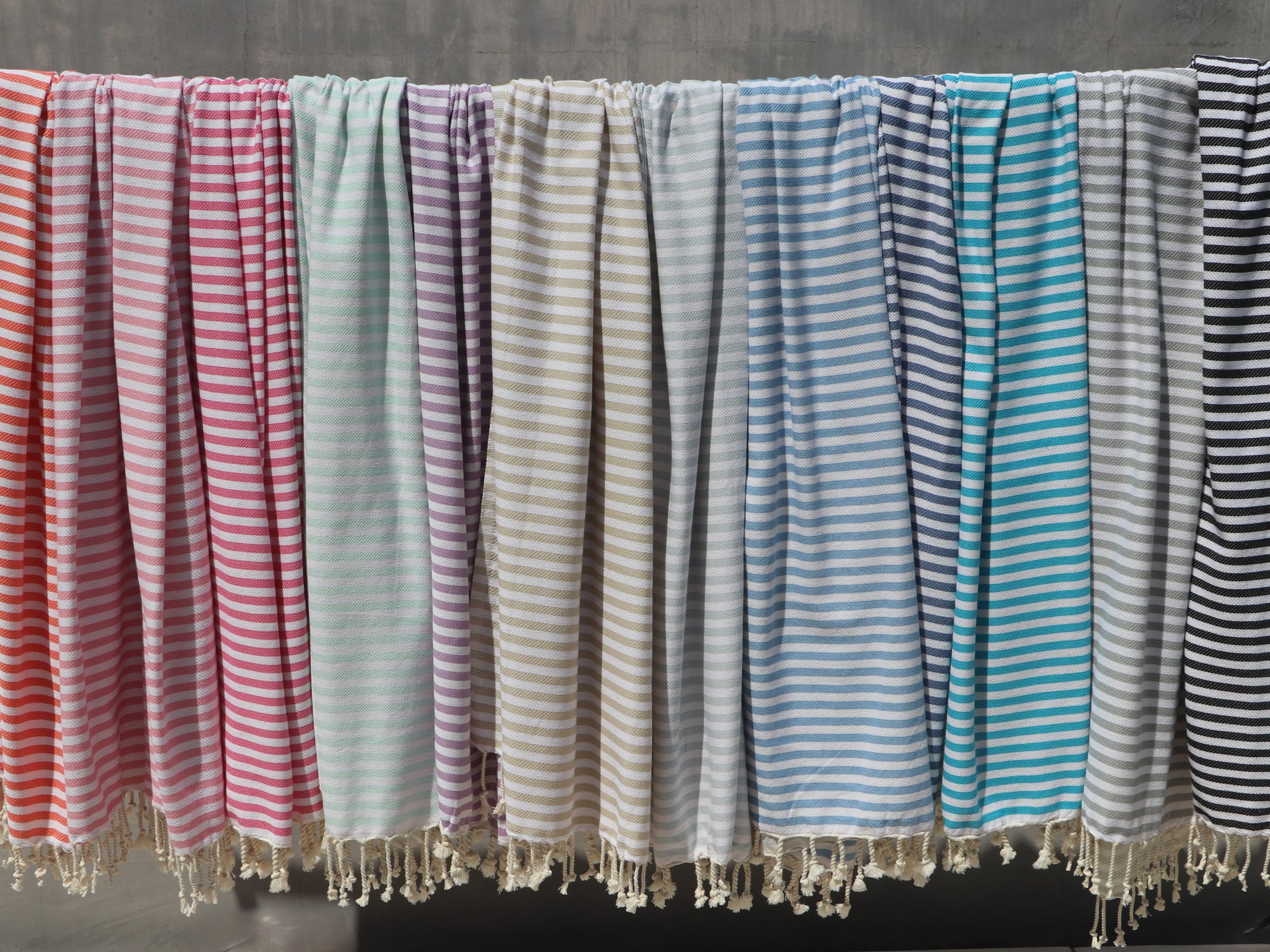 Bronte turkish towels in 12 colours hanging