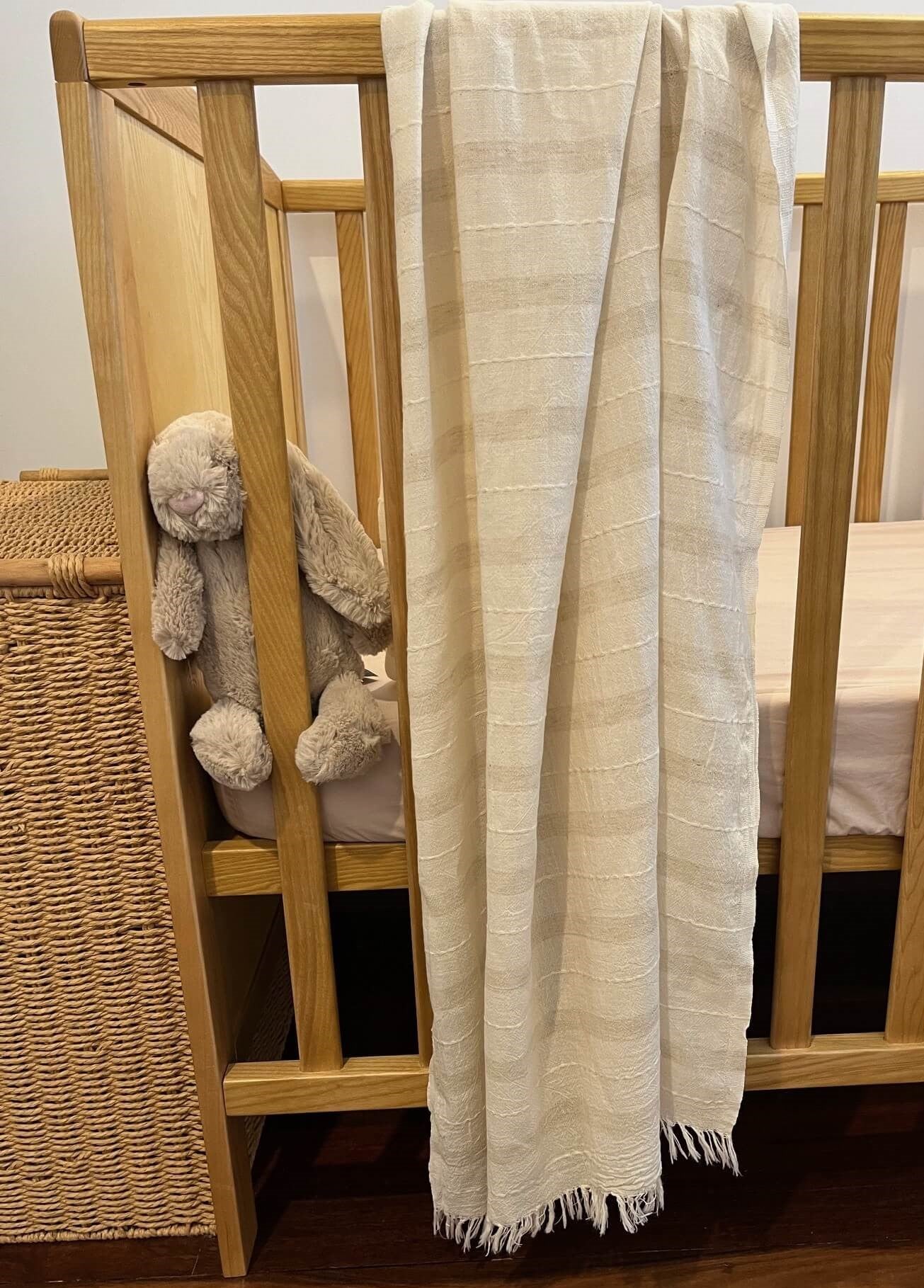 Eden linen look cotton scarf displayed on a cot