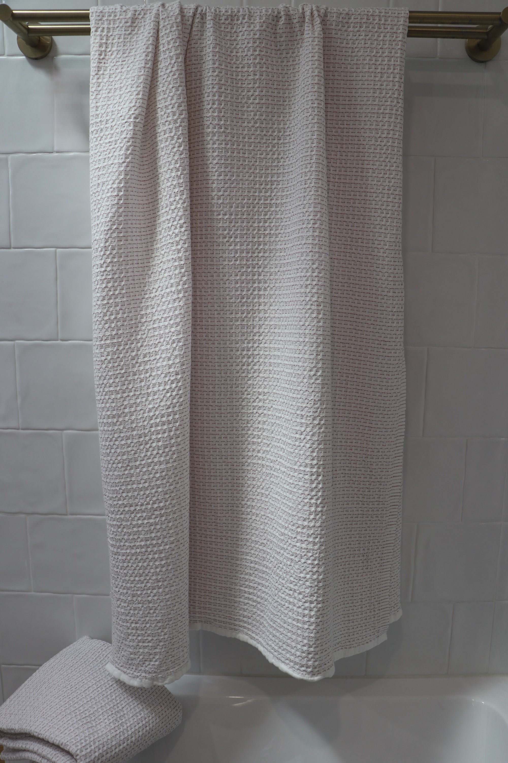 waffle bath towel holloways rust colour hanging